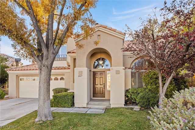 mediterranean / spanish-style house featuring a garage