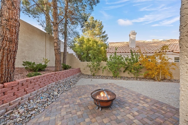 view of patio / terrace with a fire pit