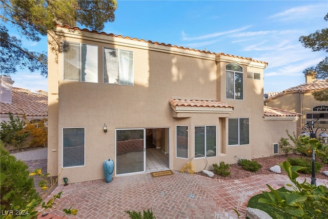 back of property with a patio area