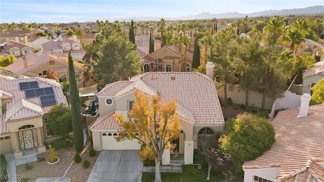 birds eye view of property with a mountain view