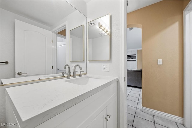 bathroom featuring tile patterned flooring and vanity