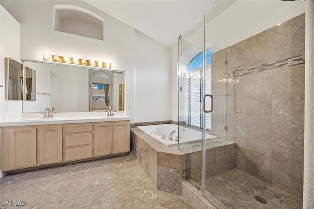 bathroom featuring shower with separate bathtub and vanity