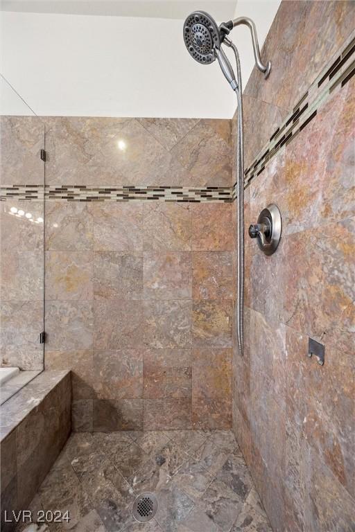 bathroom with a tile shower