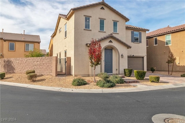 mediterranean / spanish-style home featuring a garage