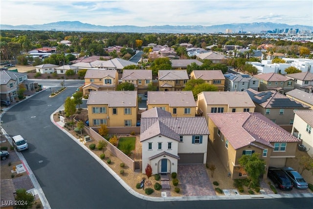 birds eye view of property with a mountain view