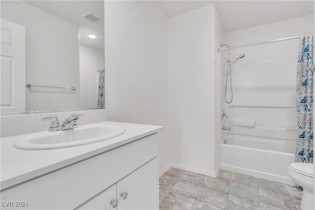 full bathroom with vanity, shower / bath combination with curtain, and toilet