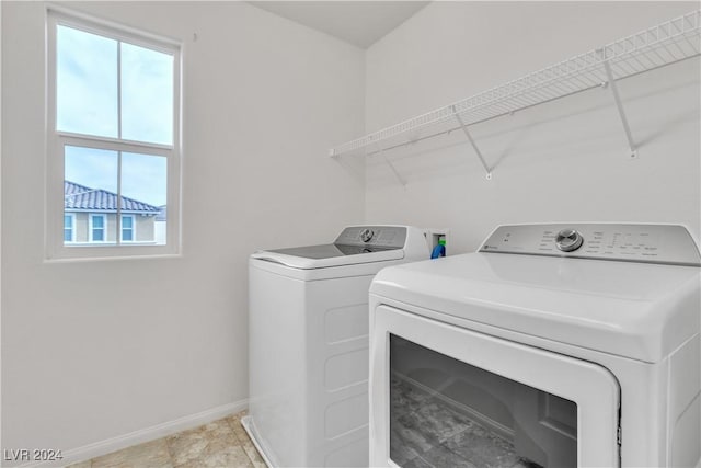 laundry room with independent washer and dryer