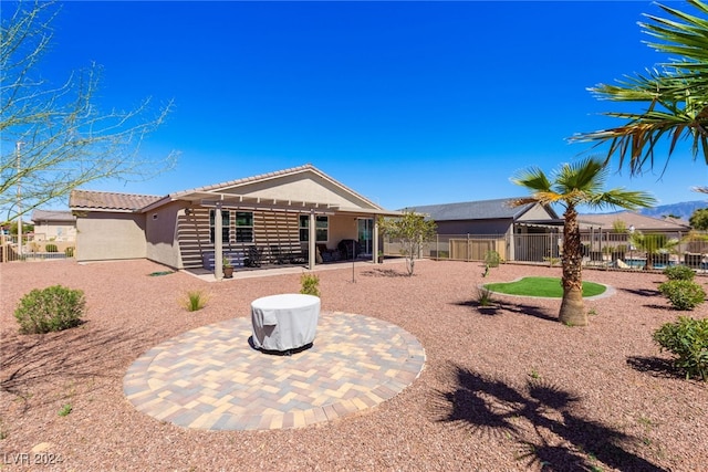 back of house featuring a patio area