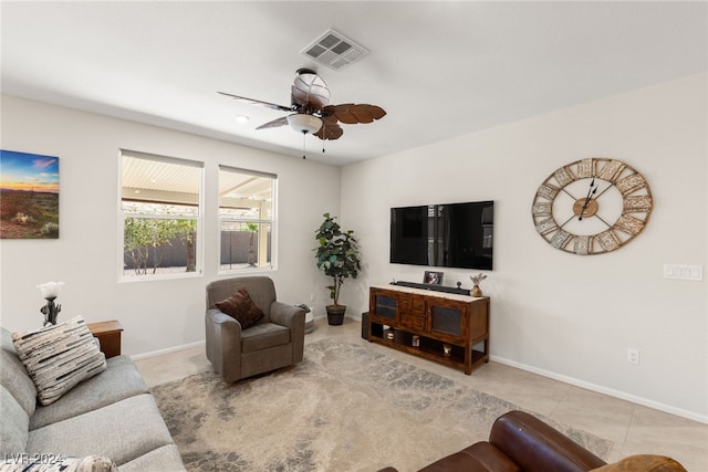 living room featuring light tile patterned floors and ceiling fan