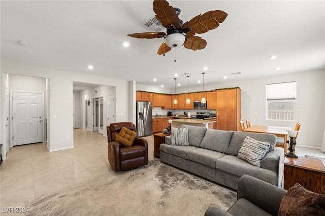 tiled living room with ceiling fan