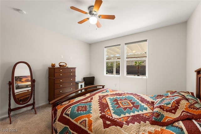 bedroom featuring light carpet and ceiling fan