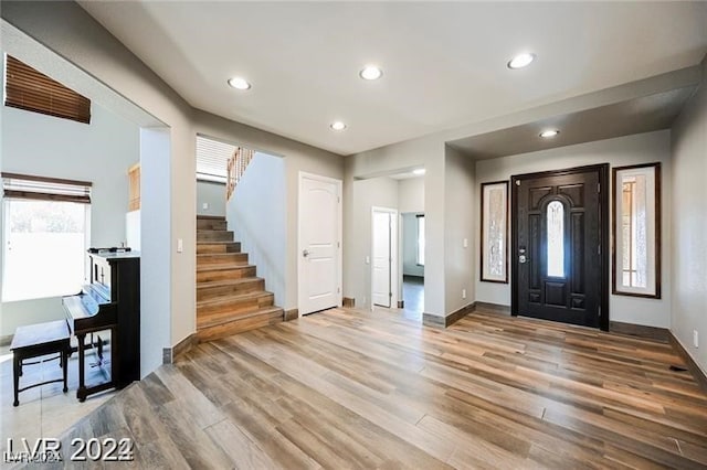 entryway with hardwood / wood-style flooring