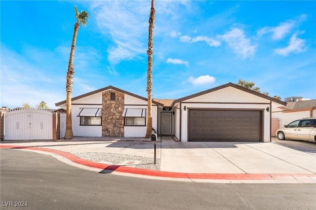 ranch-style home featuring a garage