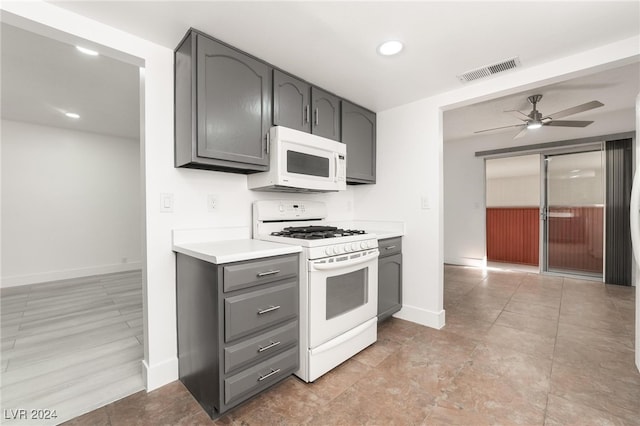 kitchen featuring ceiling fan, gray cabinets, and white appliances