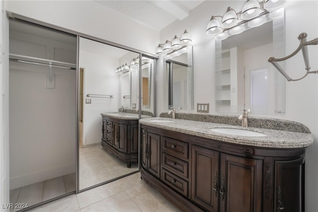 bathroom with vanity and tile patterned floors