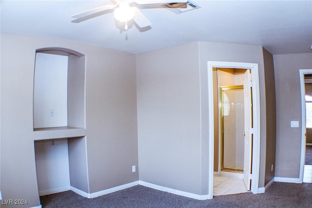 unfurnished bedroom with light colored carpet and ceiling fan