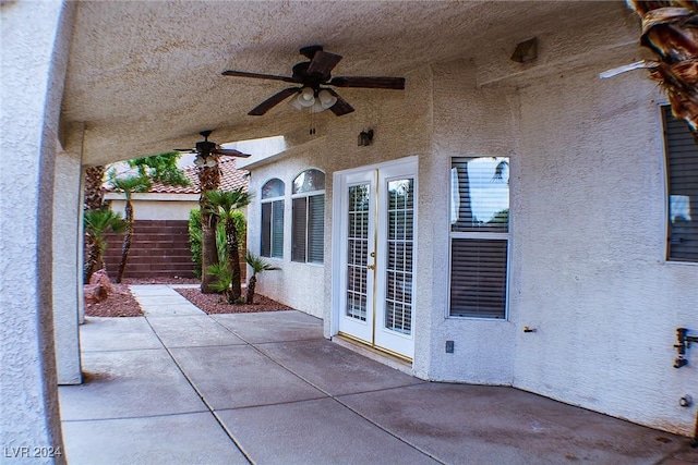 view of patio with french doors and ceiling fan