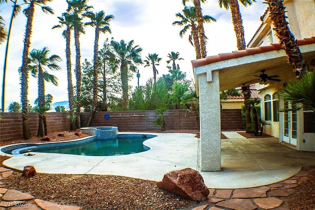 view of swimming pool with an in ground hot tub, ceiling fan, and a patio