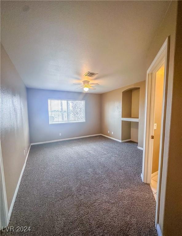 carpeted empty room with ceiling fan