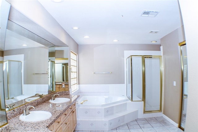 bathroom with tile patterned floors, plus walk in shower, and vanity