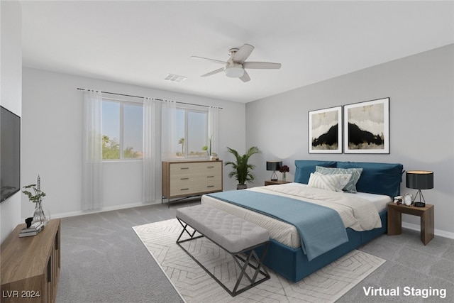 bedroom featuring light carpet and ceiling fan