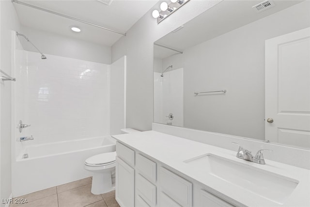 full bathroom with tile patterned flooring, vanity, toilet, and tiled shower / bath combo