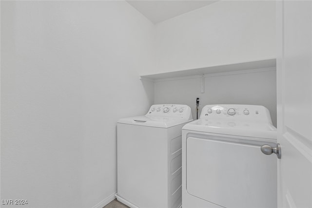 laundry area with independent washer and dryer