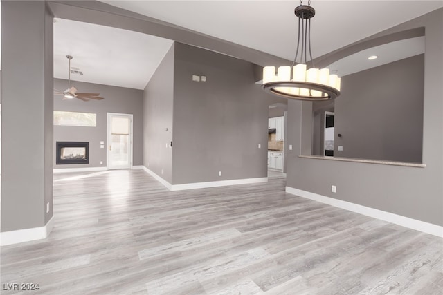 empty room featuring ceiling fan and light hardwood / wood-style flooring