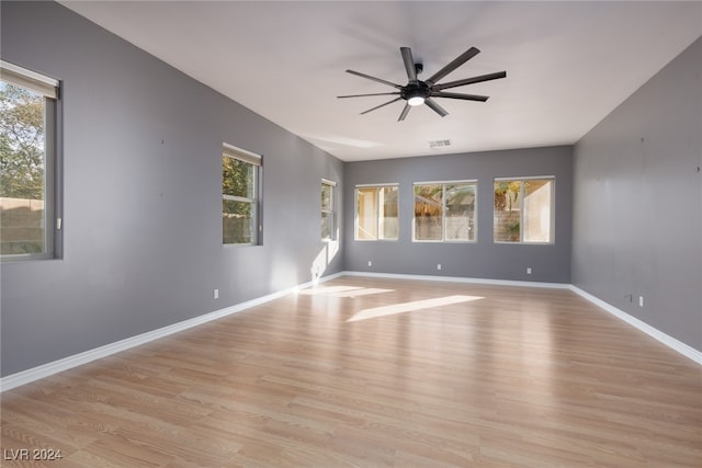 spare room with light hardwood / wood-style floors and ceiling fan