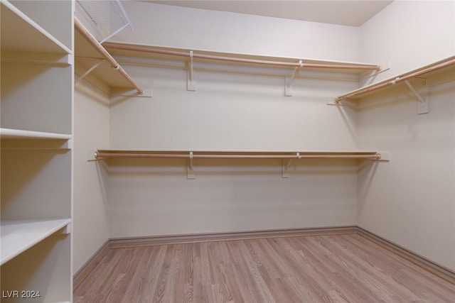 spacious closet featuring light hardwood / wood-style flooring