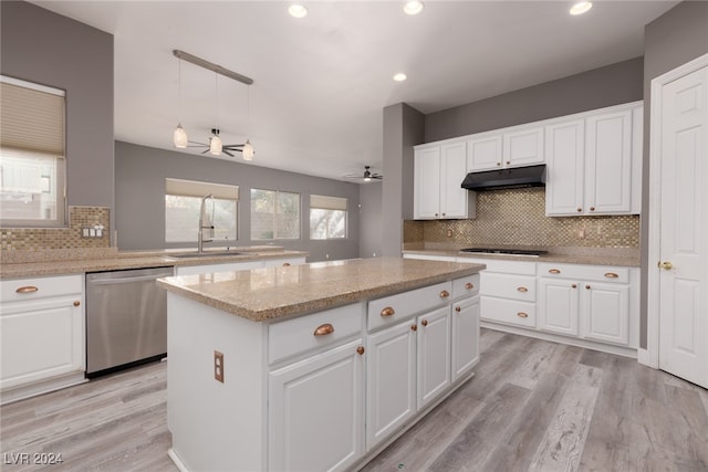 kitchen featuring dishwasher, white cabinetry, ceiling fan, and sink