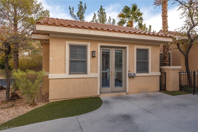 property entrance with french doors and a patio