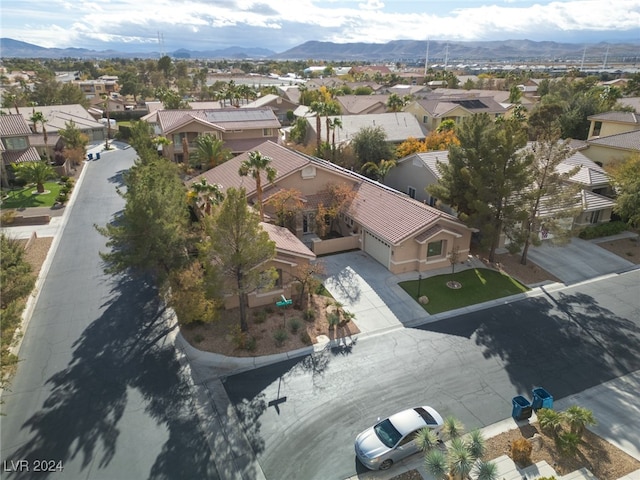 birds eye view of property with a mountain view