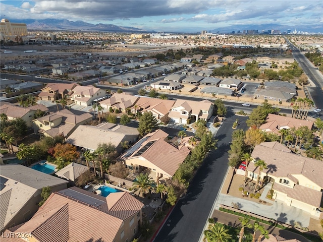 birds eye view of property with a mountain view