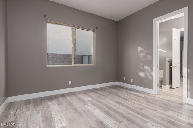 empty room with light hardwood / wood-style floors