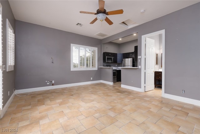 unfurnished living room with ceiling fan