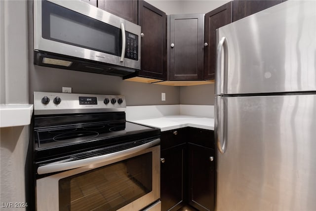 kitchen featuring dark brown cabinets and stainless steel appliances