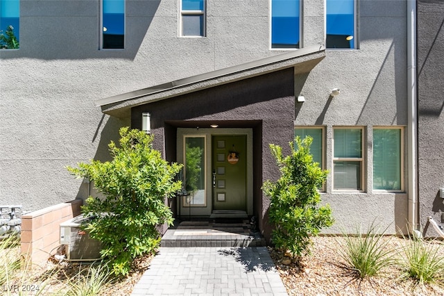 doorway to property with cooling unit