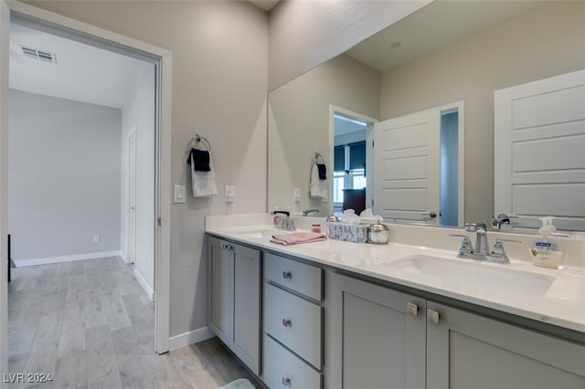 bathroom featuring wood-type flooring and vanity