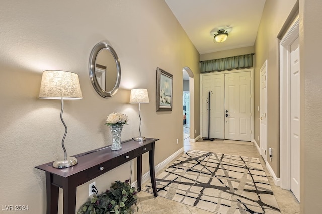 entryway featuring light tile patterned floors