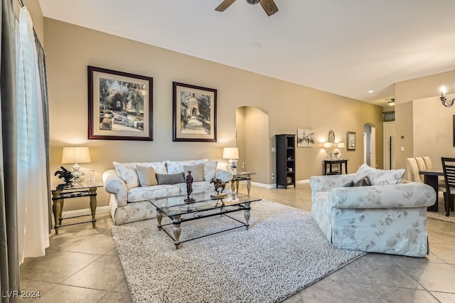 tiled living room featuring ceiling fan