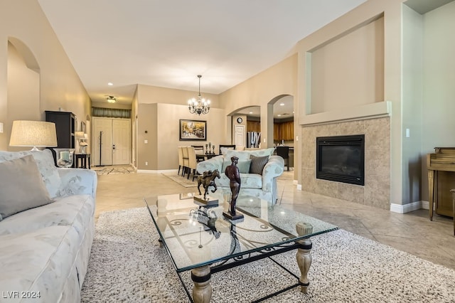 living room featuring a fireplace and an inviting chandelier