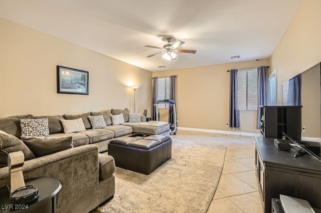 tiled living room with ceiling fan