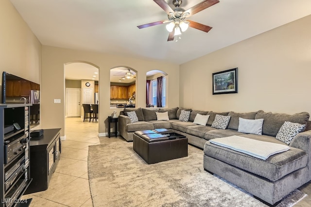 living room with ceiling fan and light tile patterned floors