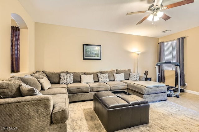 tiled living room featuring ceiling fan