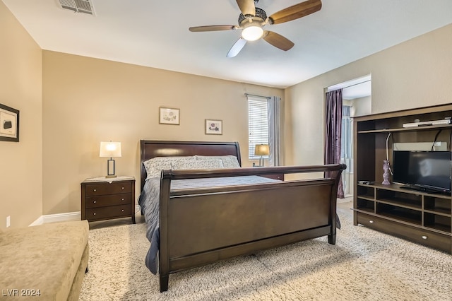 bedroom featuring ceiling fan and light colored carpet