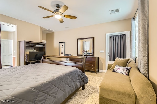 bedroom with multiple windows and ceiling fan