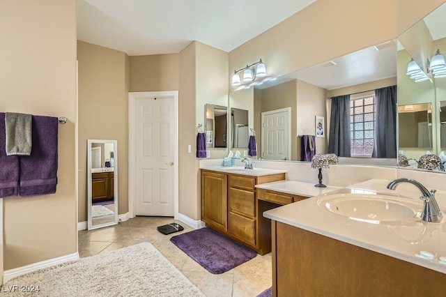 bathroom with tile patterned flooring and vanity