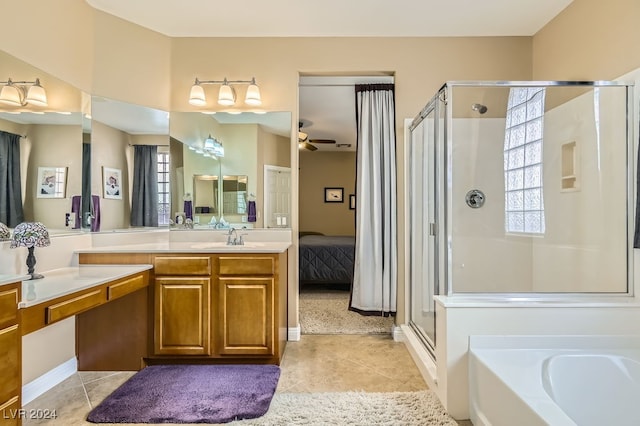 bathroom with plenty of natural light, separate shower and tub, and ceiling fan