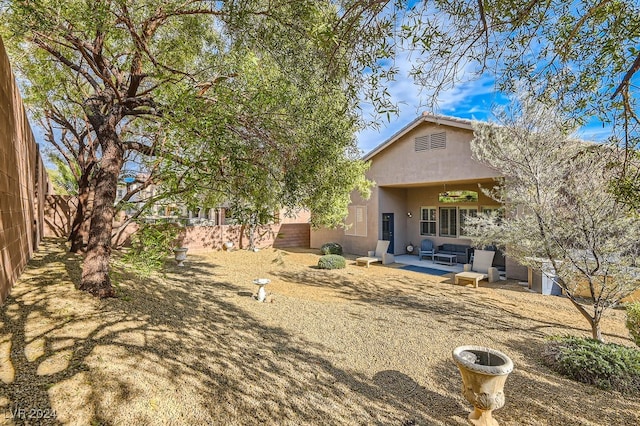 back of property featuring a patio